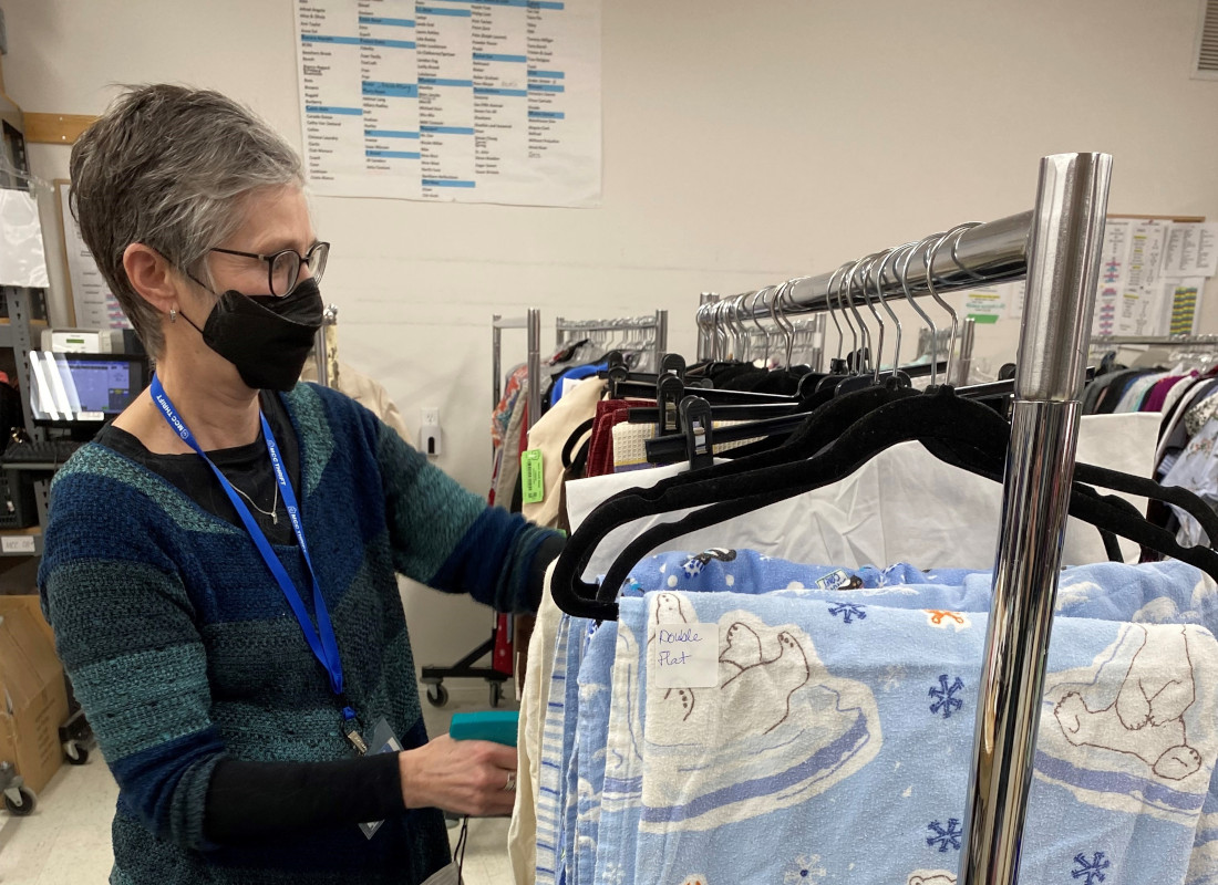 Joyce volunteering at a thrift shop