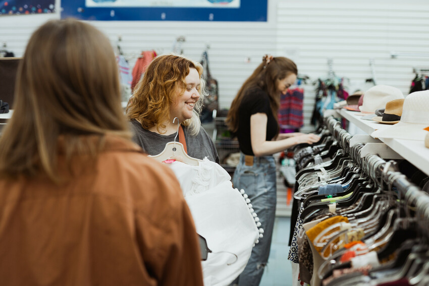 Katrina Funk and Lauren Balzer shop in the clothing department at the MCC Mission Thrift Shop.