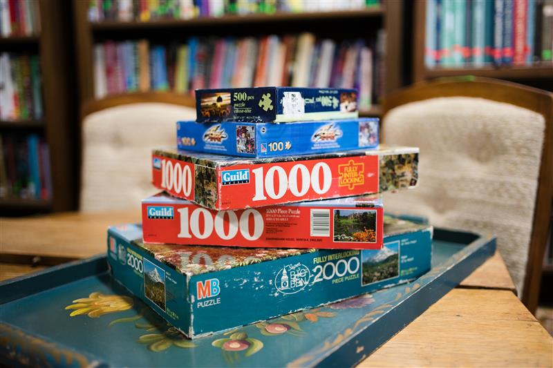 A set of puzzles of an MCC Thrift shop table.