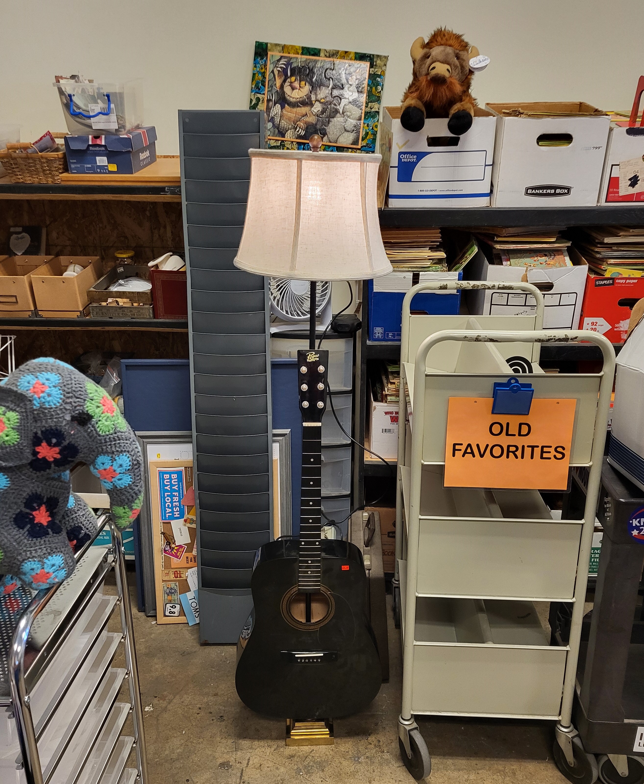 A lamp made from an old acoustic guitar.