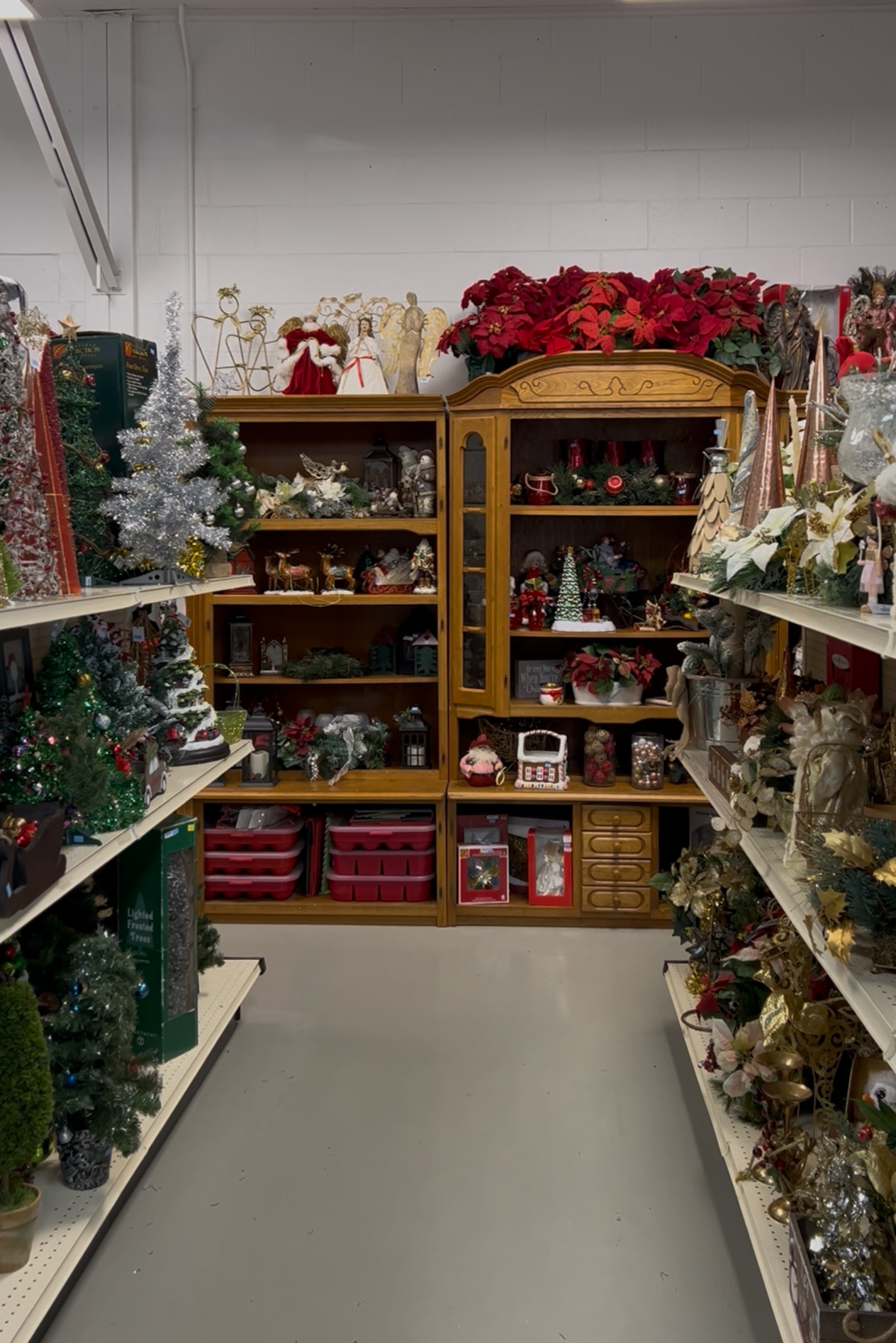 Between the aisles of the Christmas shop.