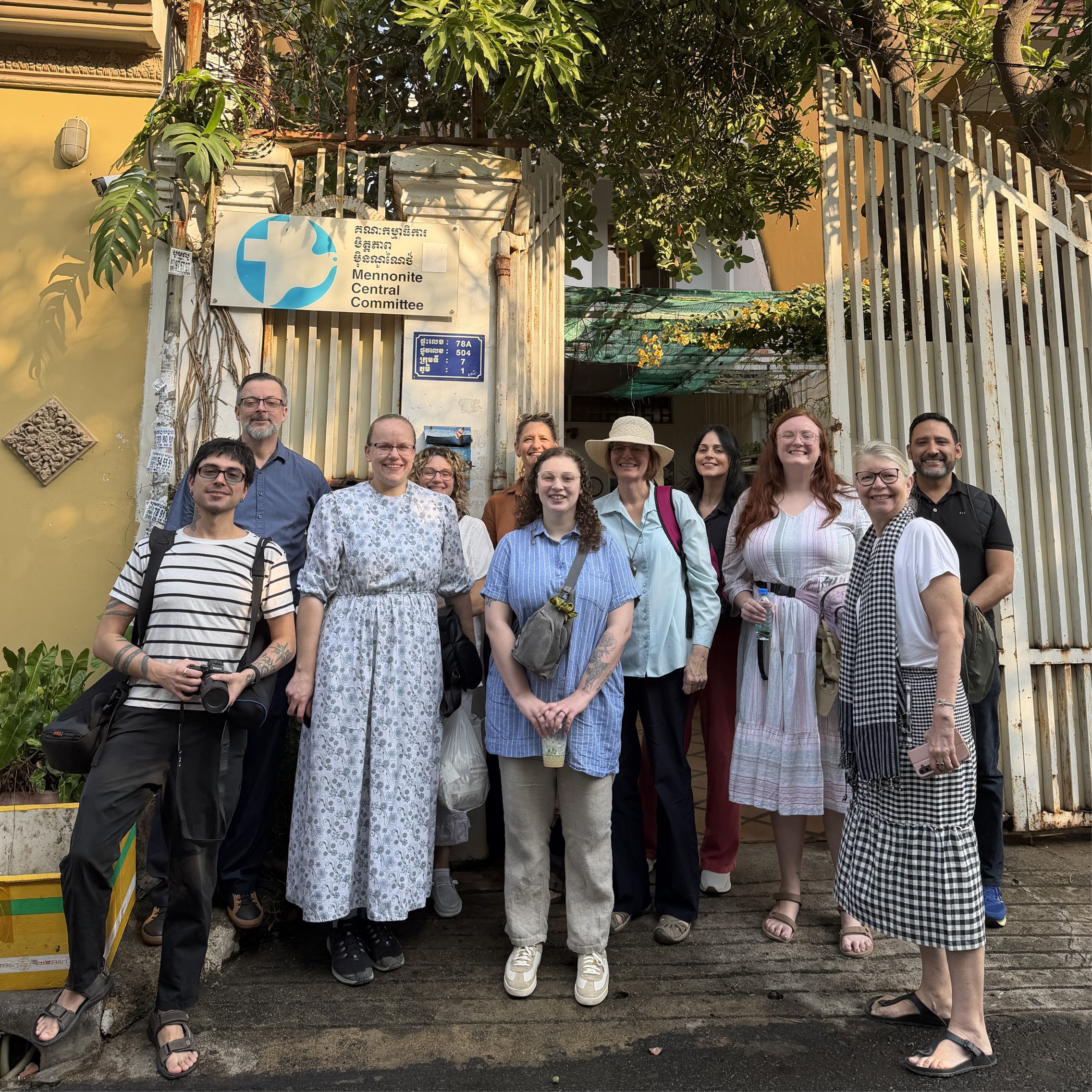 A team pose in front of the MCC office.