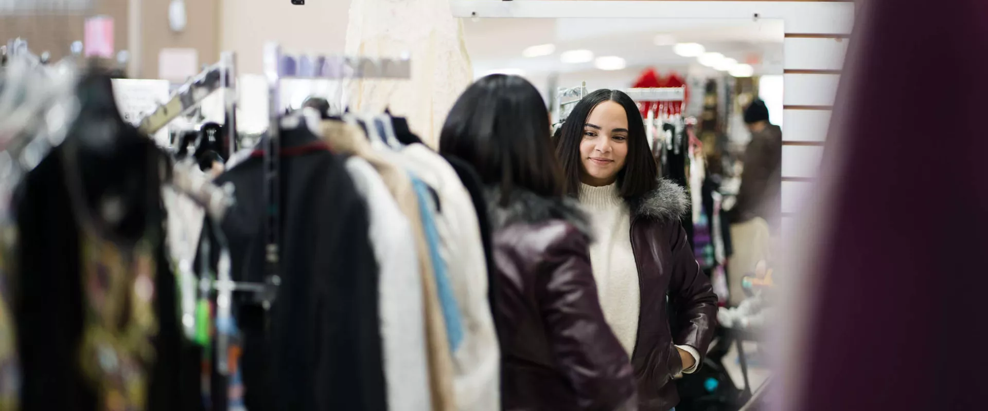 Thrift customer in front of a mirror
