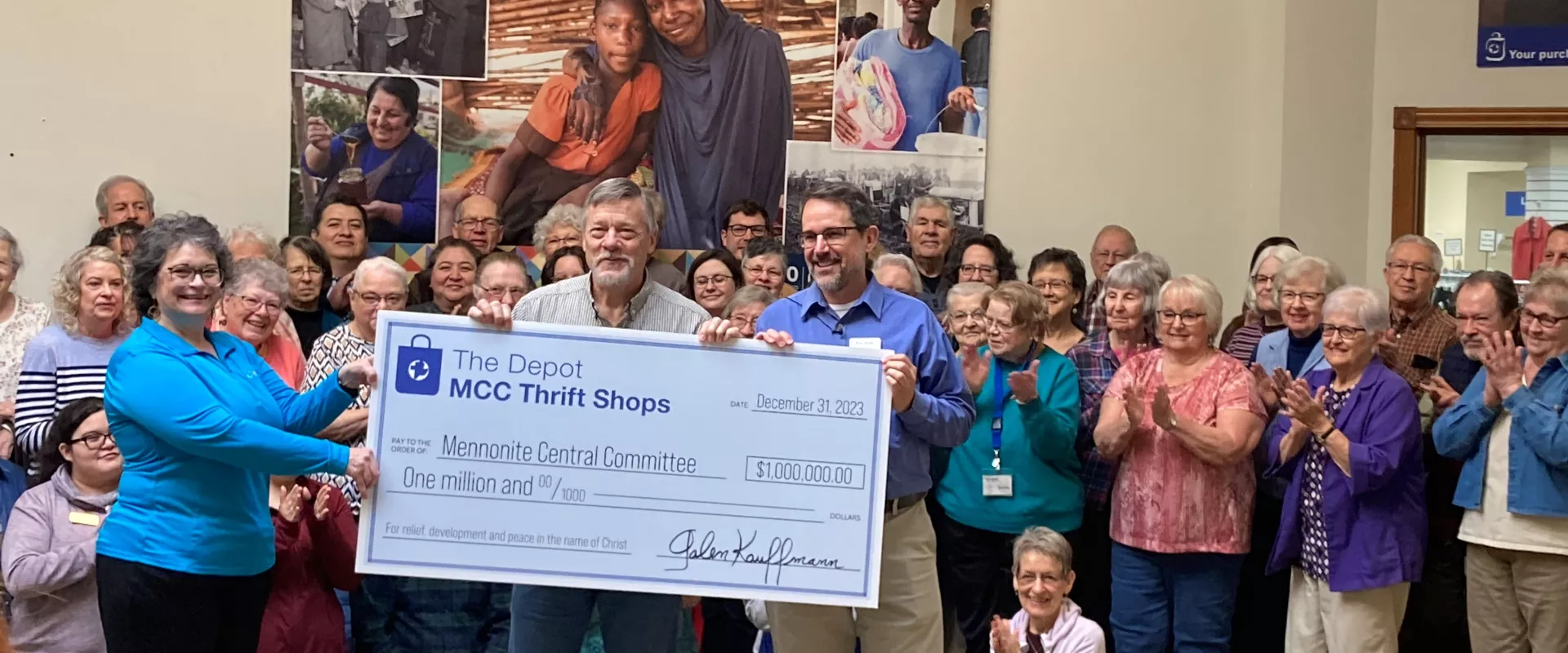 Staff and volunteers at The Depot thrift shop presenting a $1 million check.