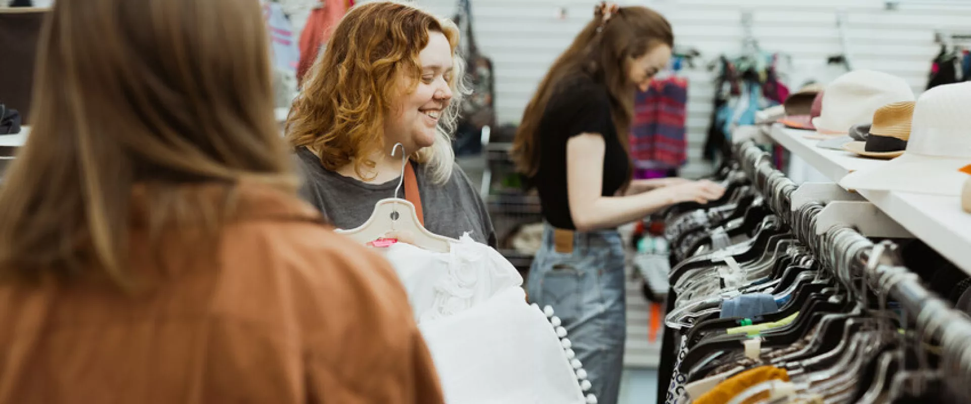 Katrina Funk and Lauren Balzer shop in the clothing department at the MCC Mission Thrift Shop.