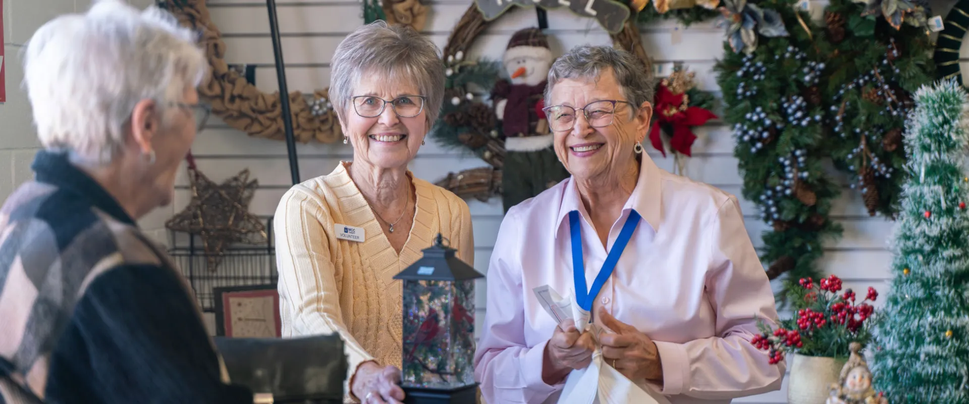Women at the checkout counter of the Christmas shop