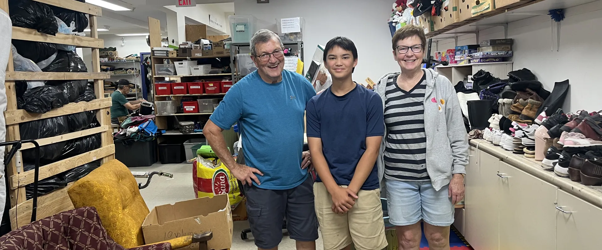 Marc, Max and Linda Little in the back of Sargent MCC Thrift Shop