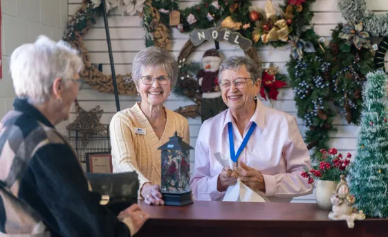 Women at the checkout counter of the Christmas shop