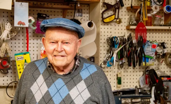 Nelson Hershey, longtime volunteer and founder of Columbia Re-Uzit Shop, sits in his favorite chair in the donation receiving area in the back of the MCC thrift shop.