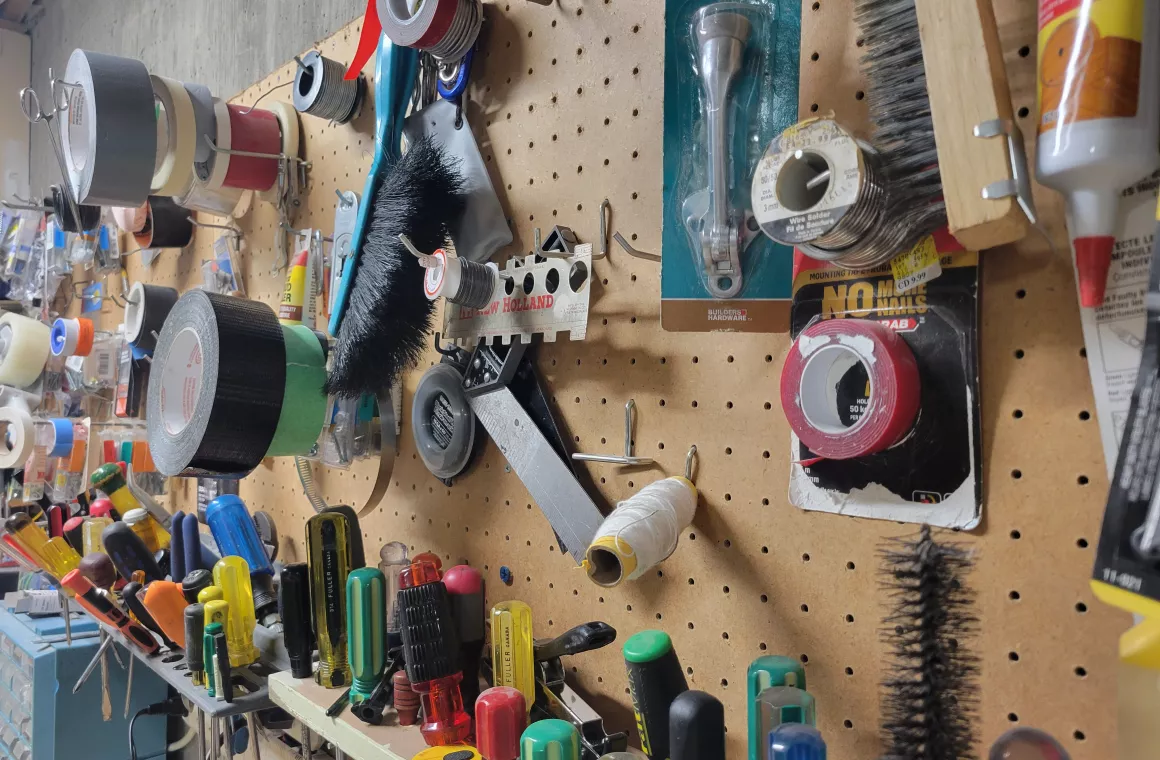 Hardware hanging on peg board