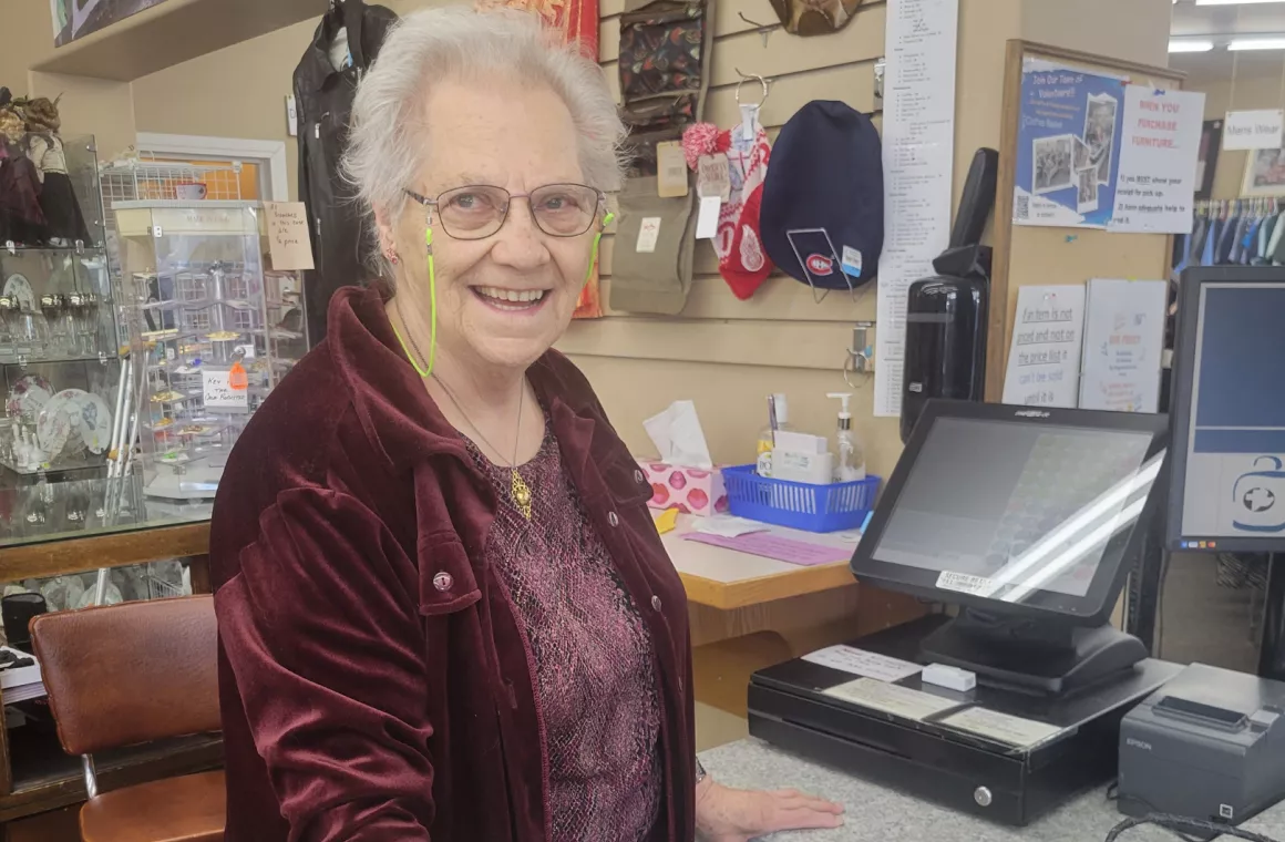 Cashier behind counter