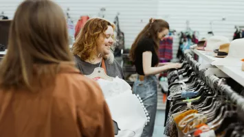 Katrina Funk and Lauren Balzer shop in the clothing department at the MCC Mission Thrift Shop.