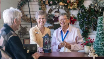 Women at the checkout counter of the Christmas shop