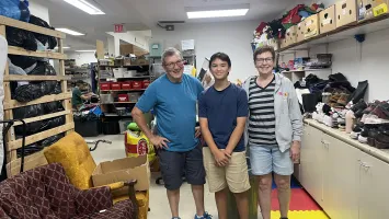 Marc, Max and Linda Little in the back of Sargent MCC Thrift Shop